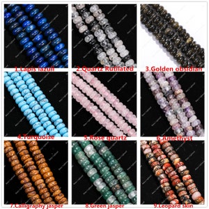 May include: A selection of gemstone beads, featuring Lapis lazuli, Quartz Rutilated, Golden obsidian, Turquoise, Rose quartz, Amethyst, Calligraphy jasper, Green jasper, and Leopard skin. Each strand showcases distinct colours and patterns.