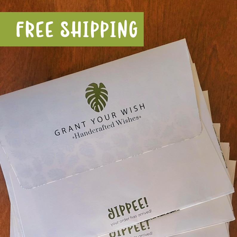 May include: A stack of white envelopes with a green leaf logo and the text "GRANT YOUR WISH Handcrafted Wishes." The bottom envelope has the text "YIPPEE! your order has arrived!" and "YIPPEE! arrived!"
