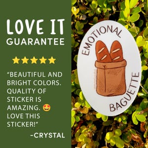 May include: White oval sticker with the text "EMOTIONAL BAGUETTE" in brown lettering. The sticker features a cartoon illustration of two brown baguettes in a brown paper bag. The text "@grantyourwish" is printed in small font on the bag.