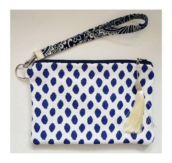 navy blue and white clutch bag