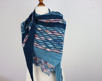 Hand-knitted asymmetrical shawl with openwork pattern in shades of blue
