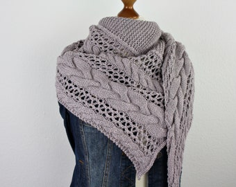 Hand-knitted asymmetrical shawl with cable pattern and lace pattern