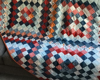 Modern Throw #scrappytriparoundtheworld in reds, blues and orange