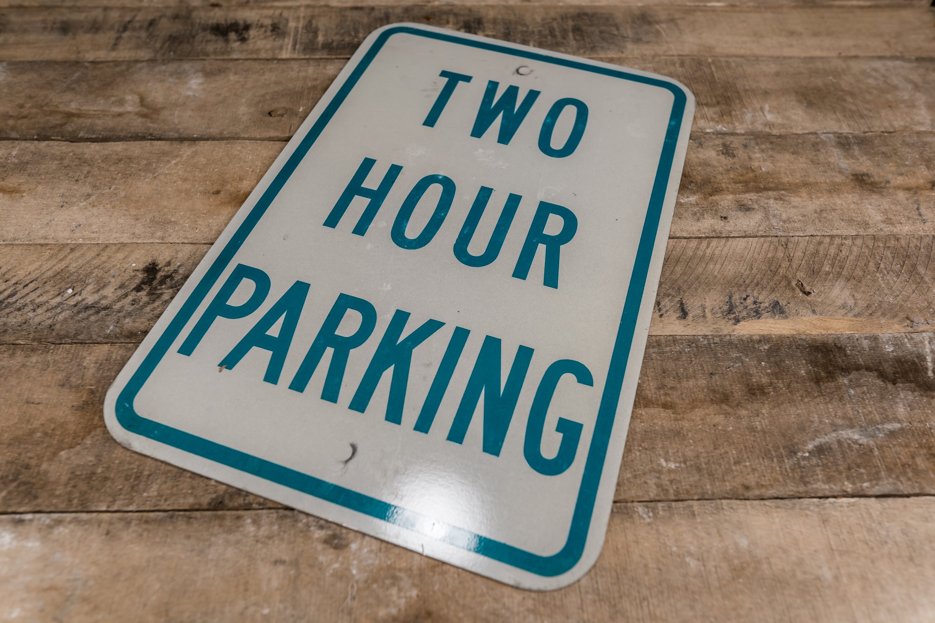 vintage-two-hour-parking-metal-street-sign-green-white-industrial