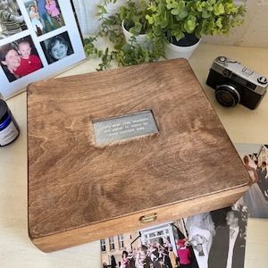 May include: A wooden box with a hinged lid and a metal latch. The box has a clear window on the top with the text "Let's make some memories we will never forget" and "20th October 2018".