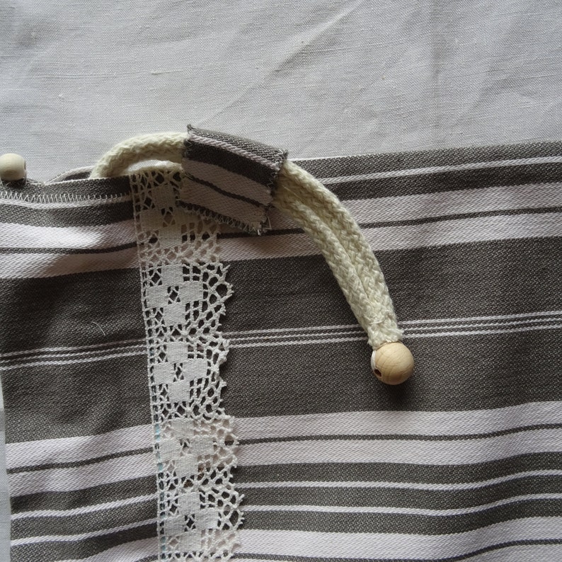 Full-lined vintage grey and white mattress canvas bread bag;