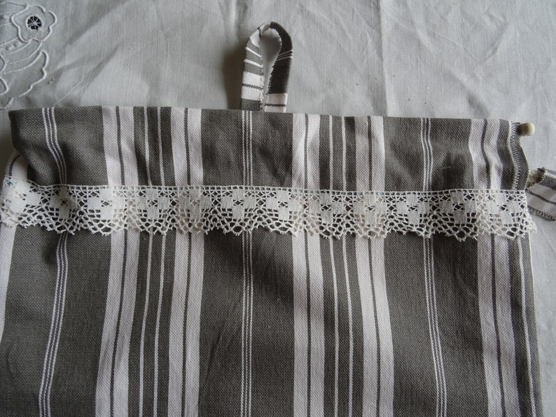Full-lined vintage grey and white mattress canvas bread bag;