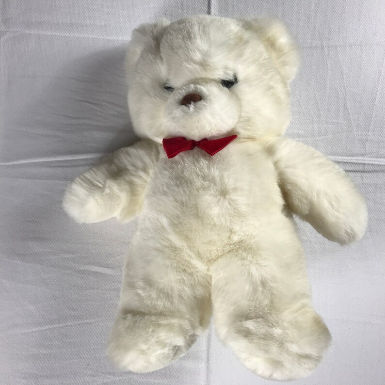 white teddy bear with red bow