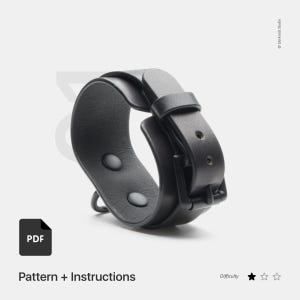 May include: Black leather bracelet with a buckle closure and two snap buttons. The bracelet is shown on a white background. PDF Pattern + Instructions. Difficulty: 2 out of 5 stars.