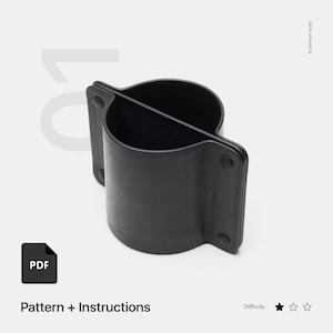 May include: Black leather DIY pattern for a cup holder. The pattern includes instructions and is rated as easy to make.