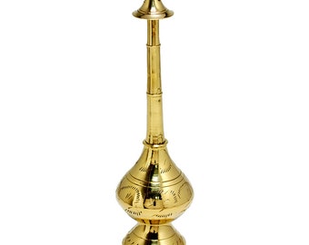 May include: A gold metal spray bottle with a decorative design. The bottle has a long, slender neck and a round base.