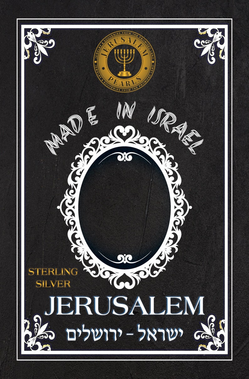 May include: A black and white image with a gold circle that says "Jerusalem Pearls Jewelry & Souvenirs from the Promised Land" with a menorah inside the circle. The text "Made in Israel" is written in a white cursive font. A white ornate frame surrounds a blank space. The text "Sterling Silver" is written in white. The text "Jerusalem" is written in blue. The text "ישראל - ירושלים" is written in blue.