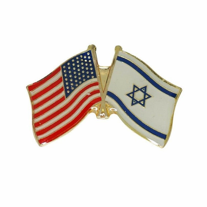 May include: A gold-colored pin with two flags, the American flag and the Israeli flag, crossed over each other.