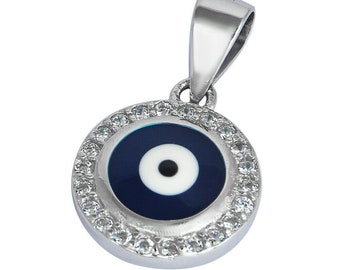 May include: A silver pendant with a blue evil eye charm surrounded by clear cubic zirconia stones.