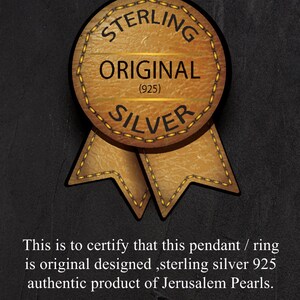 May include: Certificate of authenticity for a sterling silver pendant or ring. The certificate features a brown leather-like seal with the words "Sterling Original (925) Silver" and a gold ribbon. The text reads "This is to certify that this pendant / ring is original designed, sterling silver 925 authentic product of Jerusalem Pearls. ISRAEL JERUSALEM www.JerusalemPearls.co.il"