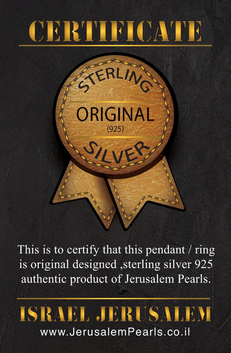 May include: Certificate of authenticity for a sterling silver pendant or ring. The certificate features a brown leather-like seal with the words "Sterling Original (925) Silver" and a gold ribbon. The text reads "This is to certify that this pendant / ring is original designed, sterling silver 925 authentic product of Jerusalem Pearls. ISRAEL JERUSALEM www.JerusalemPearls.co.il"