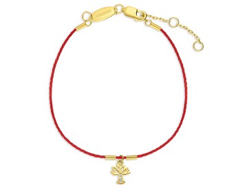 May include: Red string bracelet with a gold tree charm featuring a small diamond. The bracelet has a gold clasp and extender chain.