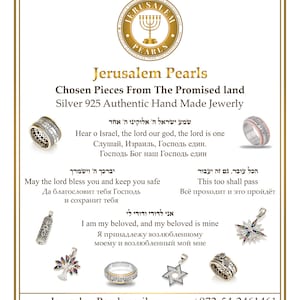 May include: Silver jewelry with Hebrew text, including a ring, a pendant with a tree of life, a pendant with a Star of David, and a pendant with a scroll. The jewelry is from Jerusalem Pearls, a company that sells authentic hand-made jewelry from the Promised Land.