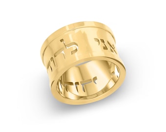 May include: A gold ring with Hebrew lettering engraved around the band.
