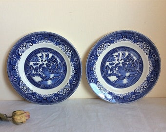 Vintage willow pattern plates, a set of 2 blue and white 7 inch plates