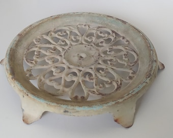 Antique cast iron trivet, an ornate French hot plate