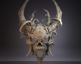May include: A detailed, off-white skull mask with large, curved horns and intricate, textured details. The mask features a prominent skull design with sharp teeth and a pointed chin, creating a gothic or fantasy aesthetic.