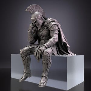 May include: A grey monochromatic figurine of a seated warrior wearing an ornate helmet with a crest, detailed chest armor, greaves, and a flowing cape. The figure is posed with one hand resting near the helmet and the other resting on a knee.