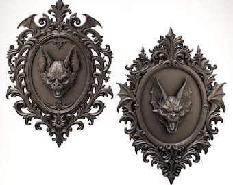 May include: Two dark grey oval wall plaques featuring sculpted bat heads centred within ornate, scrollwork frames. Each frame includes intricate floral and leaf-like details, with small bat wing accents integrated into the decorative borders.
