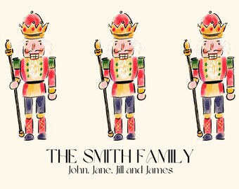 Könnte beinhalten: Drei Aquarell-Illustrationen von Nussknacker-Soldaten mit goldenen Kronen, roten und goldenen Uniformen und schwarzen Stäben. Der Text "THE SMITH FAMILY" und "John, Jane, Jill and James" befindet sich unter den Illustrationen.