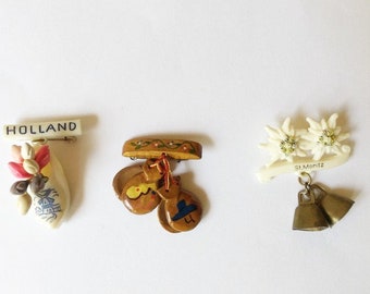 Souvenir Brooches, Choose, One Spanish Castanets, One Dutch Clog and Tulips, One Swiss Edelweiss Flowers and Bells