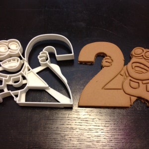 Minion Dave Cookie Cutter holding the number 2 for your kid&#39;s 2nd year birthday party. Celebrate their second with a Minions themed party.