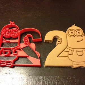 Minions cookie cutter holding the number 2. Great for your kid&#39;s second year minion theme birthday party. Celebrate their 2nd in style!
