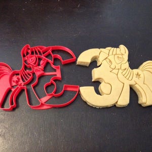 My Little Pony Princess Twilight Sparkle Cookie Cutter holding the number 3. Great for your kid&#39;s third birthday. My Little Pony 3rd Party!