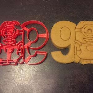 Minions cookie cutter holding the number 9. Great for your kid&#39;s ninth year minion theme birthday party. Celebrate their 9th in style!