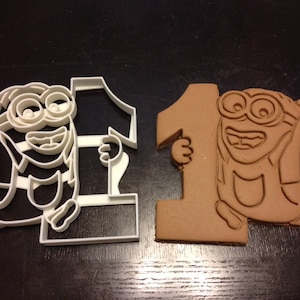 Minion Dave Cookie Cutter holding the number 1. Great for your kid&#39;s first birthday! Celebrate their 1st with a minions themed party.