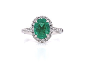 Platinum emerald and diamond engagement ring