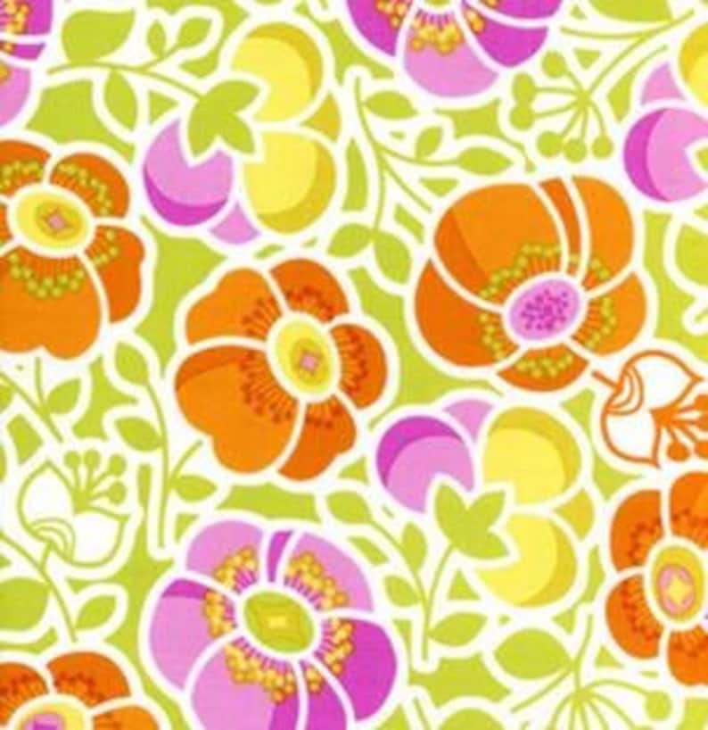 May include: A green fabric with a repeating pattern of orange, pink, and yellow flowers. The flowers have a white outline and are surrounded by green leaves.