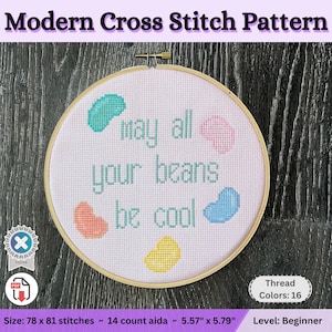 May include: A cross stitch pattern featuring jelly beans and the text "May all your beans be cool". The pattern is 78 x 81 stitches and uses 14 count Aida fabric. It measures 5.57 inches by 5.79 inches and requires 16 colors of thread.