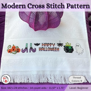May include: White cross-stitch towel featuring a Halloween design. The design includes pumpkins, witch boots, a bat, the words "HAPPY HALLOWEEN", a cauldron, and a ghost. The towel has a fringed edge. The text "Modern Cross Stitch Pattern" is at the top.