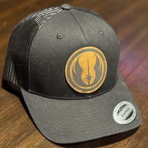 May include: A rustic wooden sign with the text "Welcome to our home" in white lettering. The sign features a distressed finish and a simple, inviting design, perfect for a front porch or entryway.