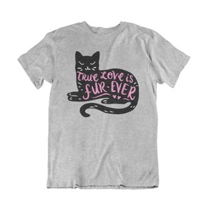 May include: A light gray t-shirt featuring a black cat illustration with the text "True love is fur-ever" in pink. The cat is lying down with its tail curled. The shirt is made of a soft material.