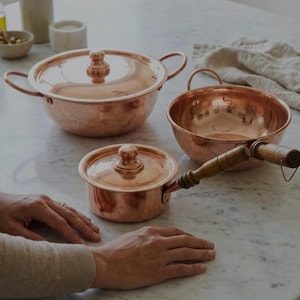 May include: A rustic wooden sign with the text "Welcome" in a handwritten style. The sign is painted white with a distressed finish, and a small, decorative heart is attached. The background is a blurred image of a wooden surface.