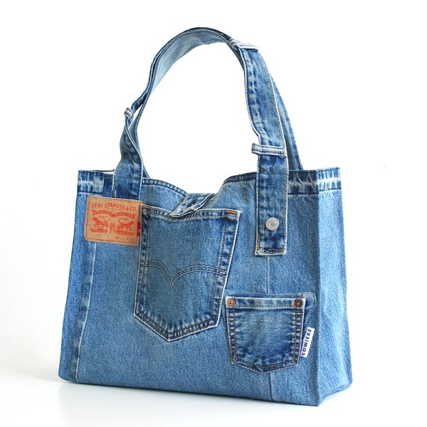 Upcycled denim tote bag from a old levis jeans with stiched corners like a paperbag.