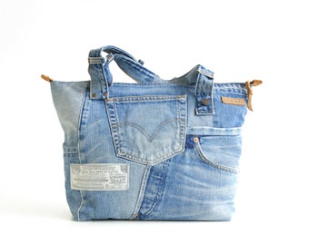 Custom para DAGMAR, bolso denim reciclado de un Levis 501 antiguo con muchos bolsillos, forro de algodón y los detalles originales