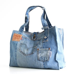 Recycjeans bag from an old Levi's 501 with lots of pockets, a cotton lining and the original details.