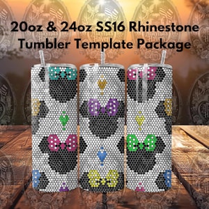 May include: Three stainless steel tumblers with a rhinestone design. The tumblers are 20 oz and 24 oz. The design features a black and white pattern with colorful accents. The tumblers are on a wooden surface.