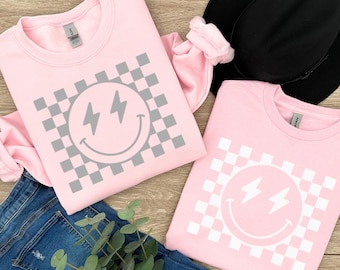 Checkered Lightning Bolt Eyes Smiley Face Sweatshirt