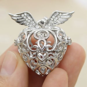 2 piezas flotantes con forma de corazón abierto, ala de ángel, jaula de cristal, colgante con forma de ángel llamador, bola para difusor de aceites esenciales aromáticos, fabricación de joyas