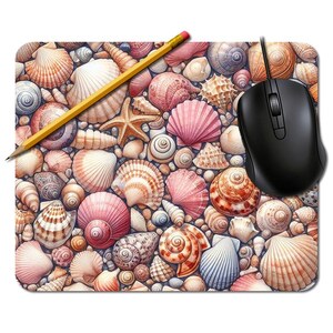 May include: A rectangular mousepad featuring a detailed illustration of various seashells in shades of pink, beige, and white. A yellow pencil and a black computer mouse are placed on top of the mousepad.