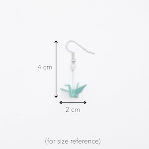 An example of the size of the earrings. They are two centimetres in width and four centimetres in length.